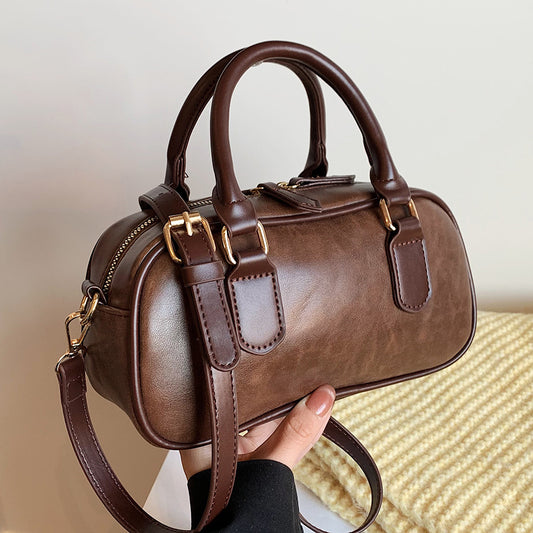 Front view of Caspian Vael brown retro square bag in brown