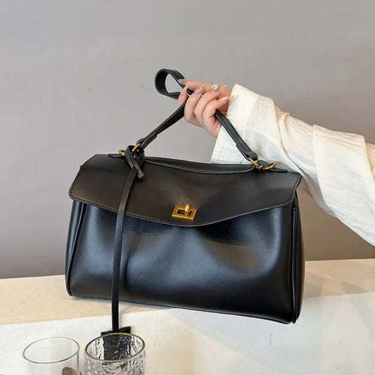Caspian Velm minimalist soft tote bag with elegant lock clasp and stitching