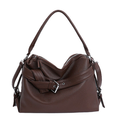Brown leather large retro tote bag with a strap on a white background